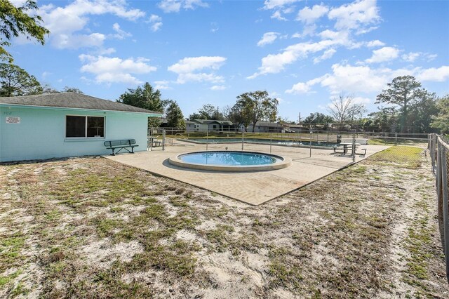 view of pool featuring a patio area