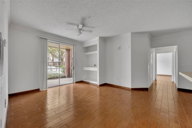 unfurnished room featuring hardwood / wood-style flooring, a textured ceiling, and ceiling fan