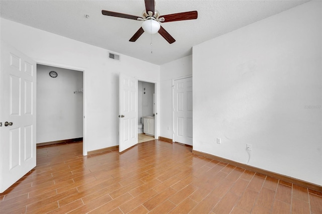 unfurnished bedroom with hardwood / wood-style flooring and ceiling fan