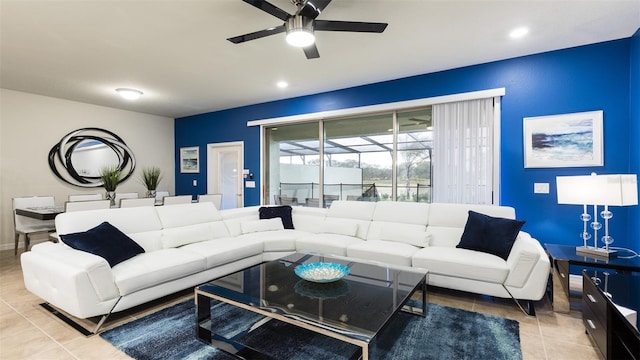 tiled living room with ceiling fan