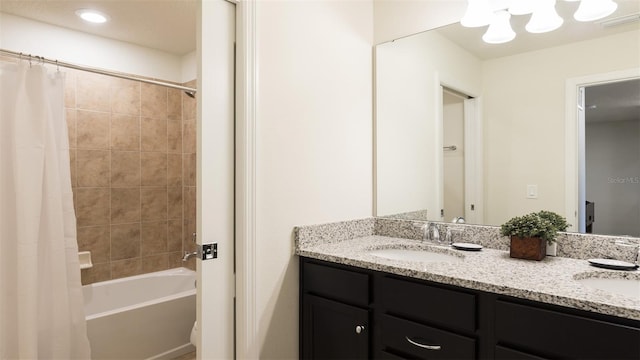 bathroom with vanity and shower / bath combination with curtain