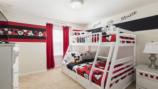 bedroom featuring carpet floors and a textured ceiling