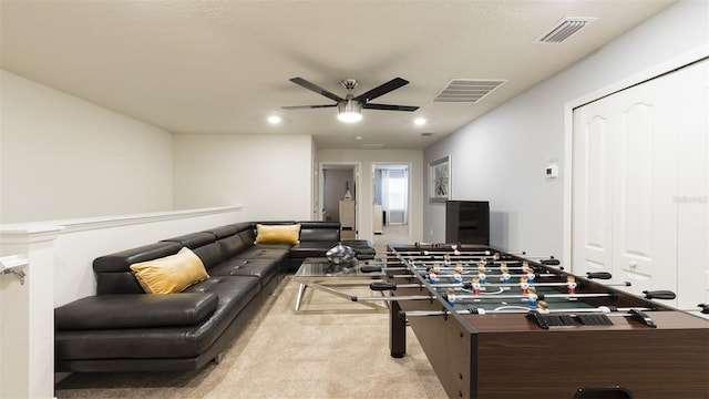 playroom featuring light carpet and ceiling fan