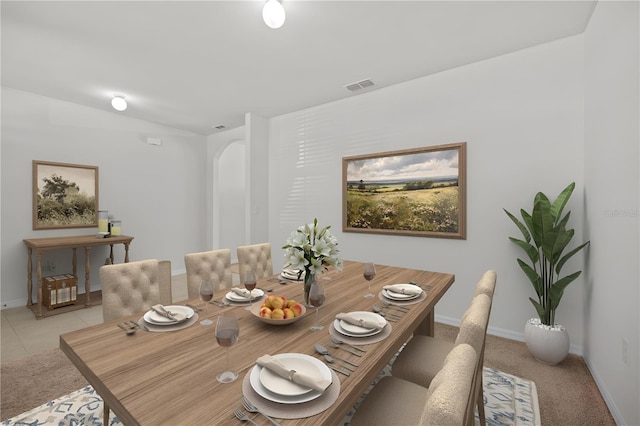 dining space featuring vaulted ceiling