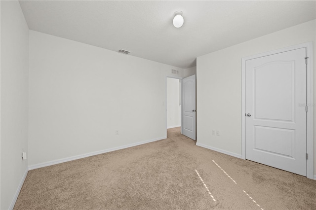 unfurnished bedroom with light carpet