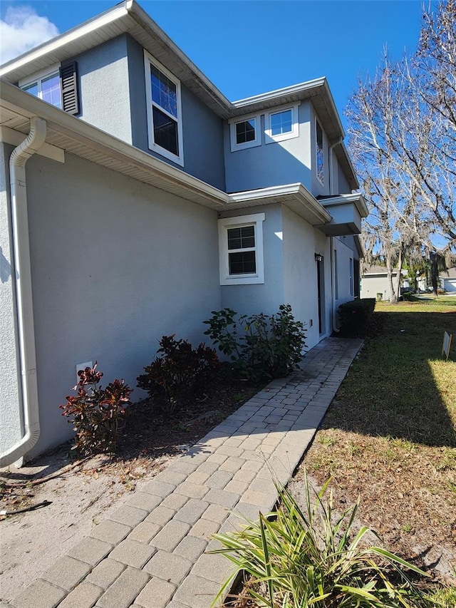 view of property exterior with stucco siding