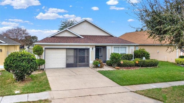 view of front of property with a garage and a front lawn