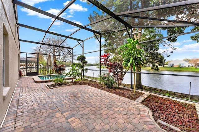 view of patio with a water view and glass enclosure