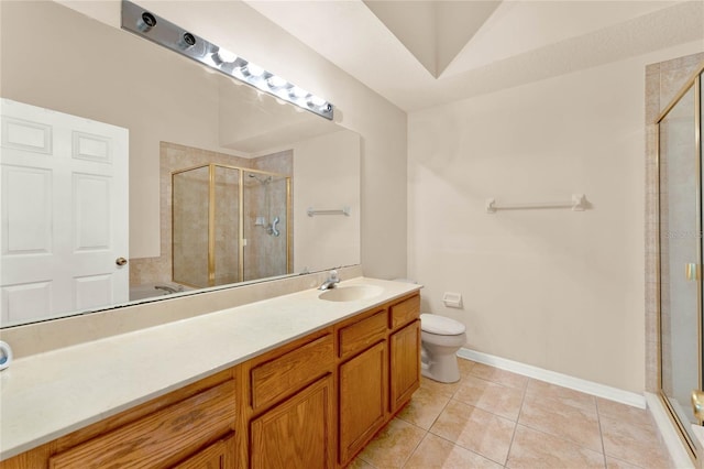 bathroom featuring vanity, toilet, tile patterned floors, and walk in shower