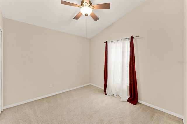 unfurnished room with ceiling fan, vaulted ceiling, and light carpet