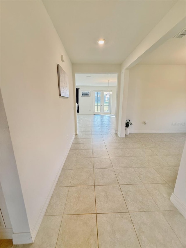 hallway with light tile patterned floors