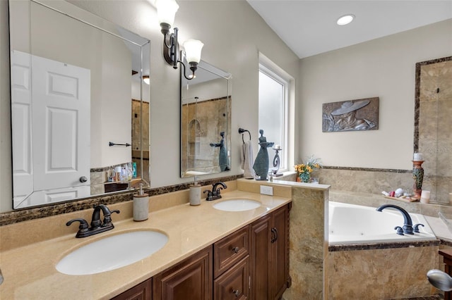 bathroom featuring vanity and separate shower and tub