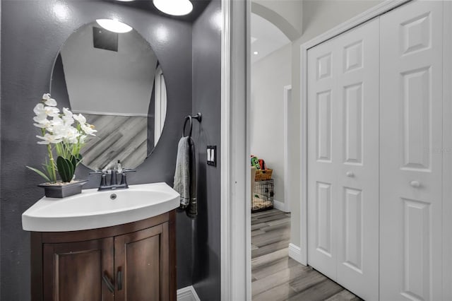 bathroom with vanity and hardwood / wood-style flooring