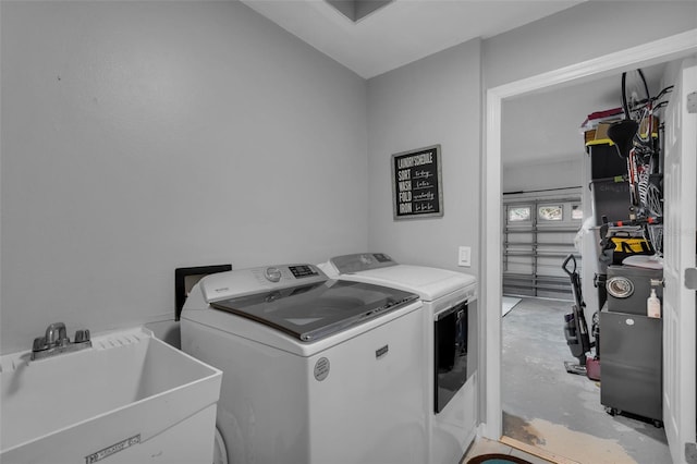 laundry area with washer and dryer and sink