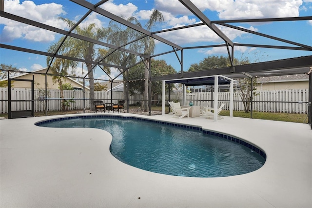 view of pool featuring a patio area and glass enclosure