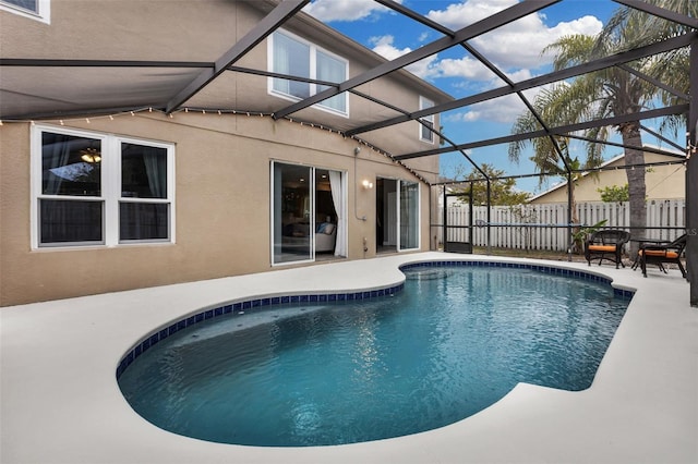 view of pool with a lanai and a patio area