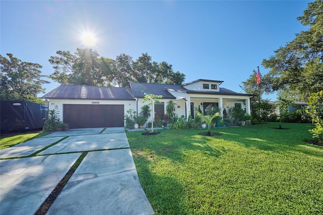 view of front of house with a garage and a front lawn