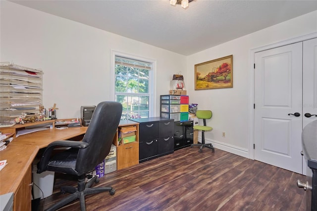 home office featuring baseboards, dark wood finished floors, and a textured ceiling