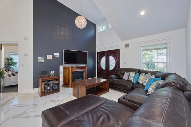 living room with marble finish floor, baseboards, high vaulted ceiling, and recessed lighting