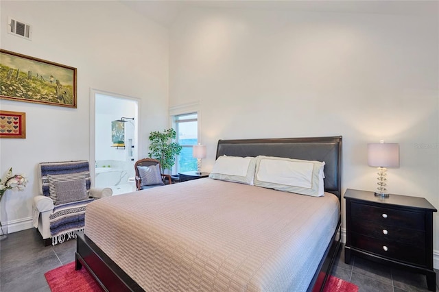 bedroom featuring high vaulted ceiling, visible vents, and baseboards