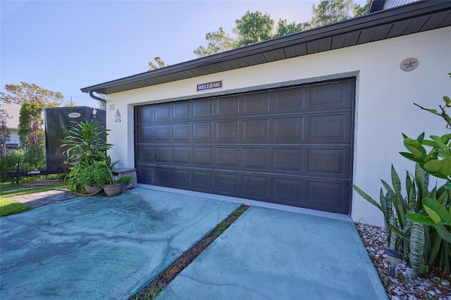 garage featuring driveway