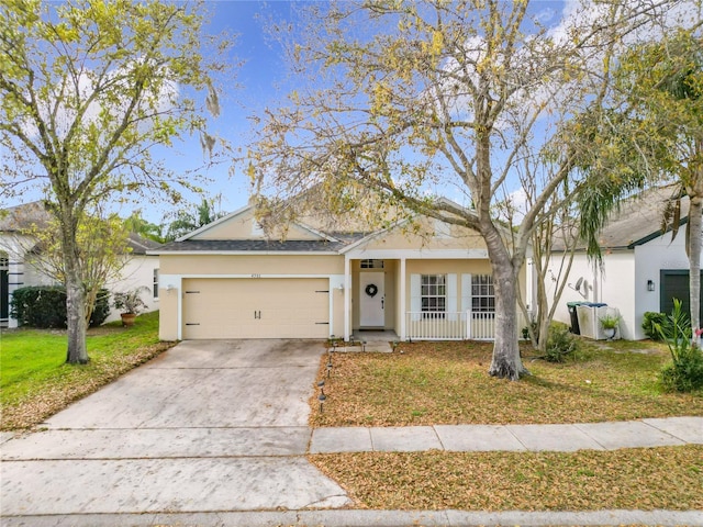 ranch-style home featuring a garage and a front lawn