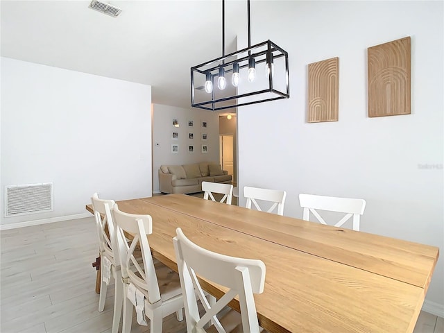 dining space with light wood-type flooring