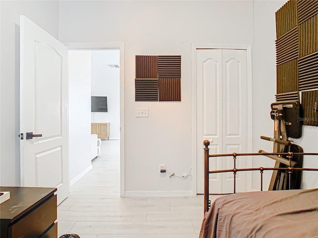 bedroom featuring a closet and light hardwood / wood-style flooring