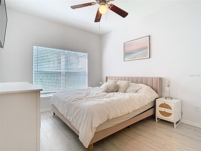 bedroom featuring ceiling fan and light hardwood / wood-style floors