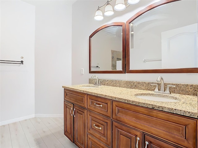 bathroom with vanity and hardwood / wood-style floors