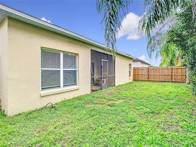 view of yard featuring a sunroom