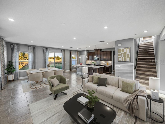 living room featuring a textured ceiling