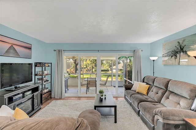 tiled living room with a textured ceiling