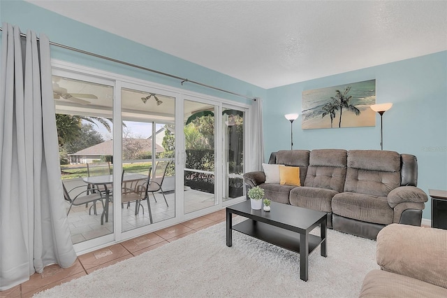 tiled living room with a textured ceiling