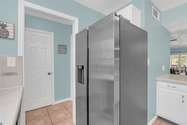 bathroom with tile patterned flooring