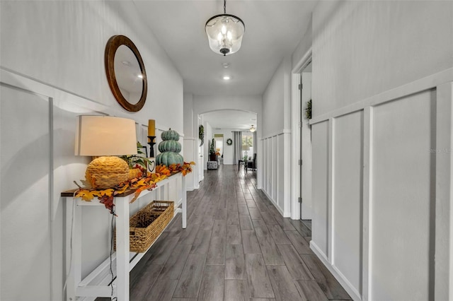 hallway with hardwood / wood-style flooring