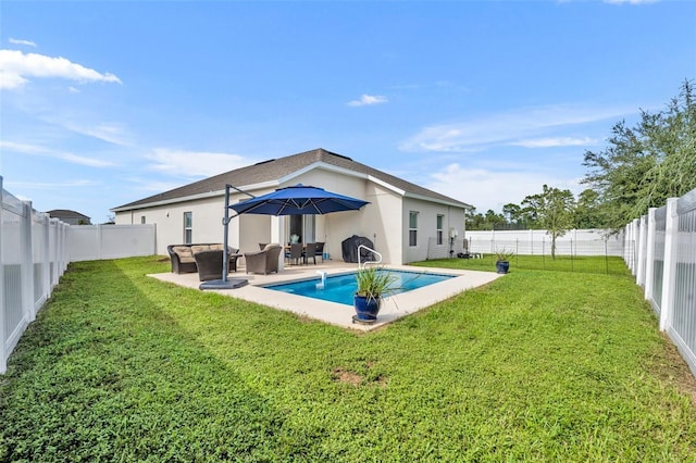 rear view of house with a fenced in pool, a patio, an outdoor hangout area, and a lawn