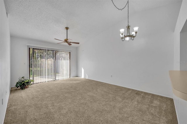 carpeted spare room featuring ceiling fan with notable chandelier, vaulted ceiling, and a textured ceiling