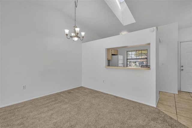 unfurnished room with lofted ceiling with skylight, light carpet, and a notable chandelier