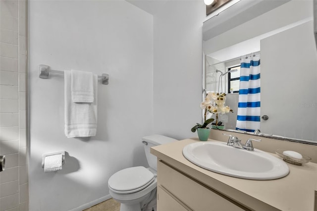 bathroom featuring vanity, toilet, and a shower with shower curtain