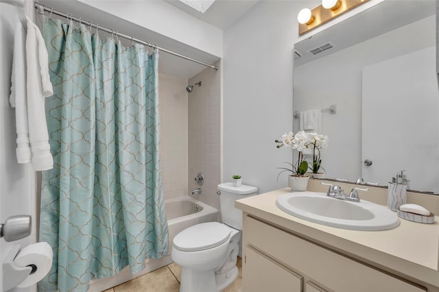 full bathroom with vanity, shower / bathtub combination with curtain, tile patterned floors, and toilet