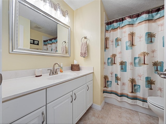full bath featuring vanity, visible vents, toilet, a textured ceiling, and tile patterned floors