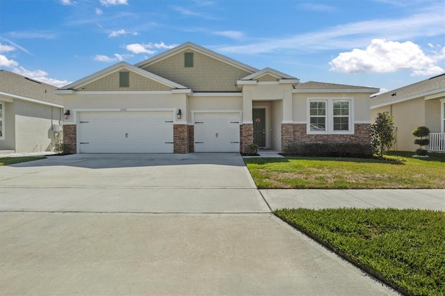 view of front facade featuring a garage and a front lawn