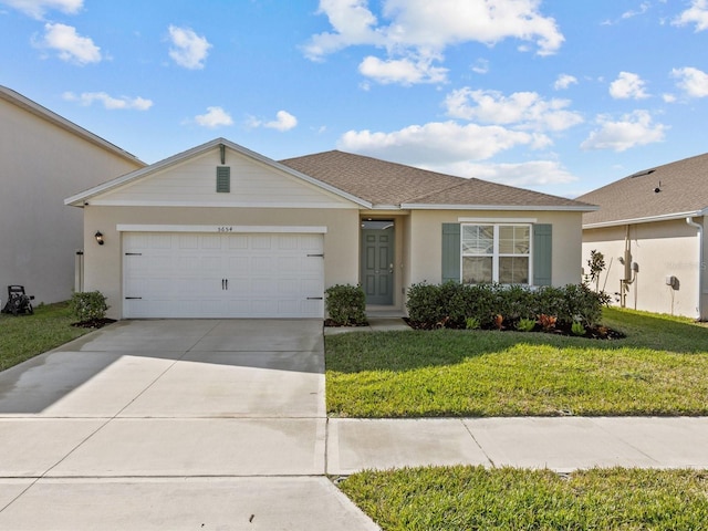 single story home with a garage and a front lawn