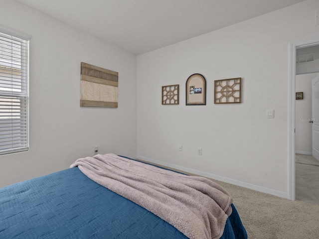 bedroom featuring light carpet