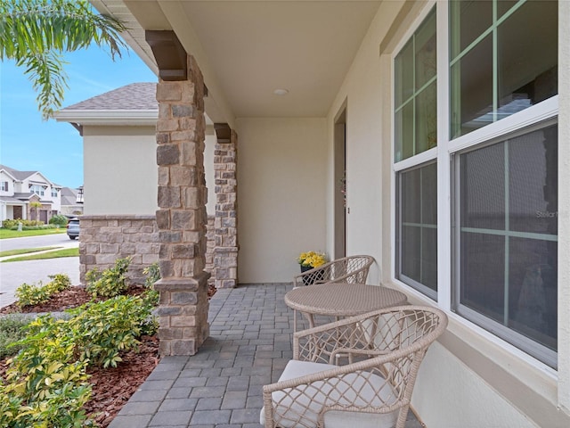 view of patio / terrace featuring a residential view and covered porch