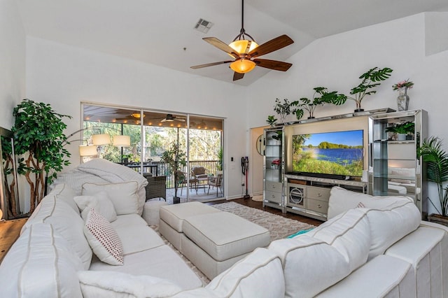 living room with ceiling fan, wood-type flooring, and vaulted ceiling