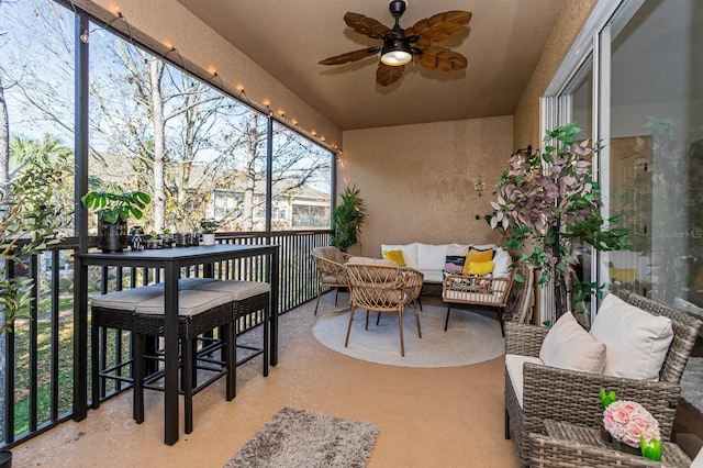 exterior space featuring ceiling fan