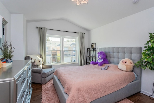 bedroom featuring dark hardwood / wood-style floors and vaulted ceiling