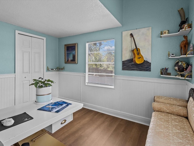 interior space with hardwood / wood-style floors and a textured ceiling